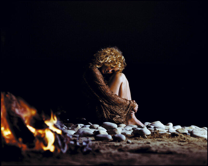 Woman Sitting on Rocks — Black, Dramatic, Night, Photograph