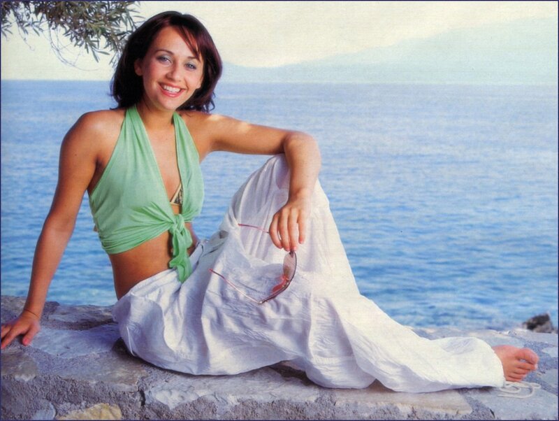 Woman Sitting on Rocks — Blue, Relaxed
