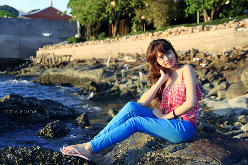 Woman Sitting on Rocks — Blue, Serene, Sunset, Photograph, Ocean