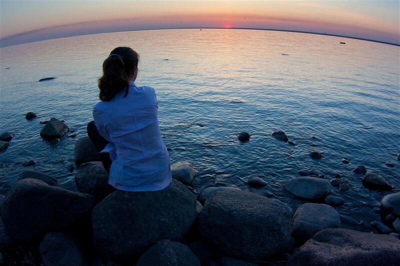 Woman Sitting on Rocks — Blue, Serene