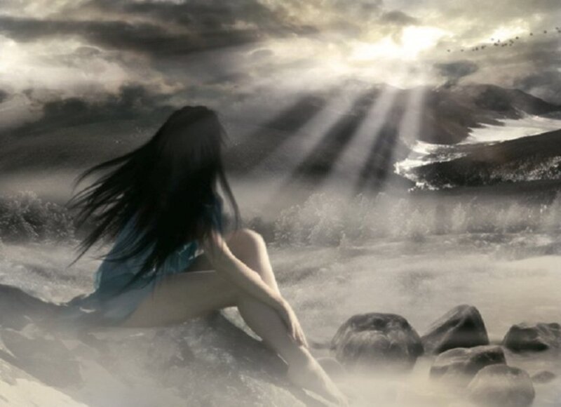 Woman Sitting on Rocks — Gray, Dramatic