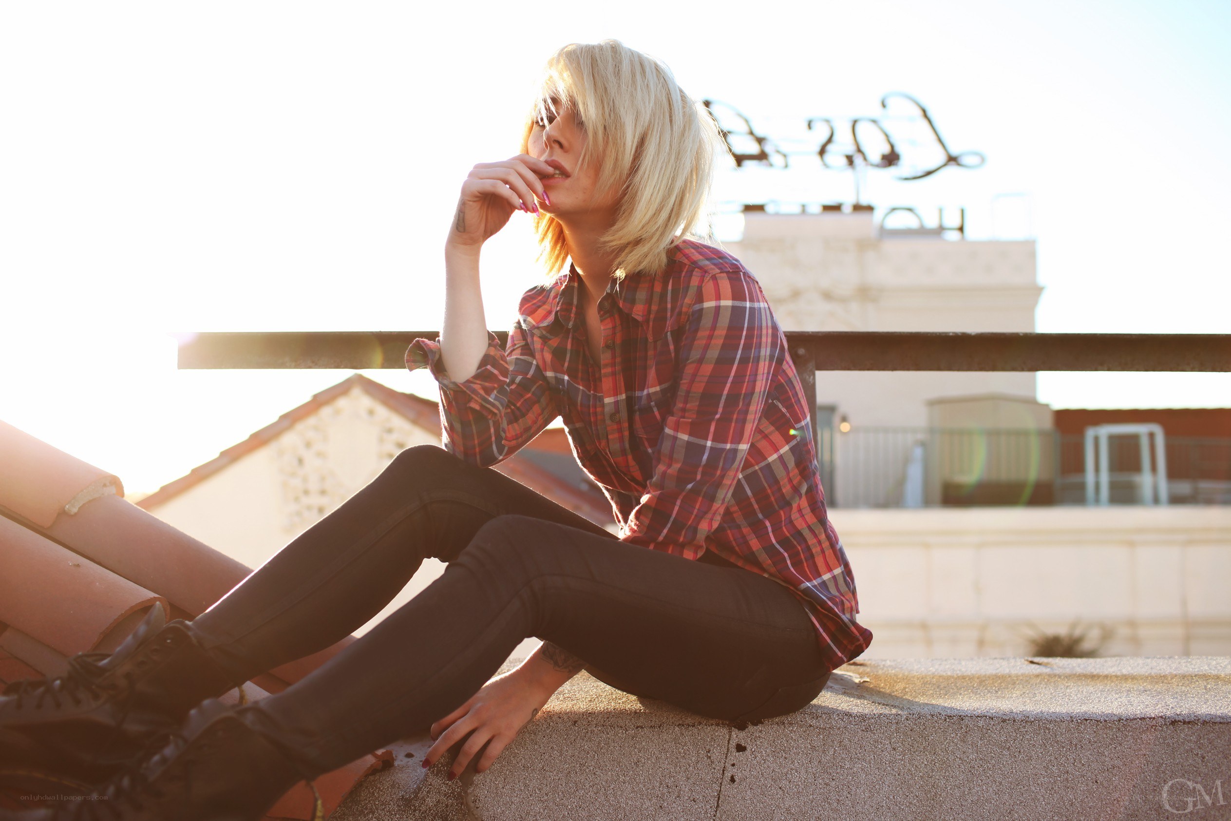 woman sitting on rooftop