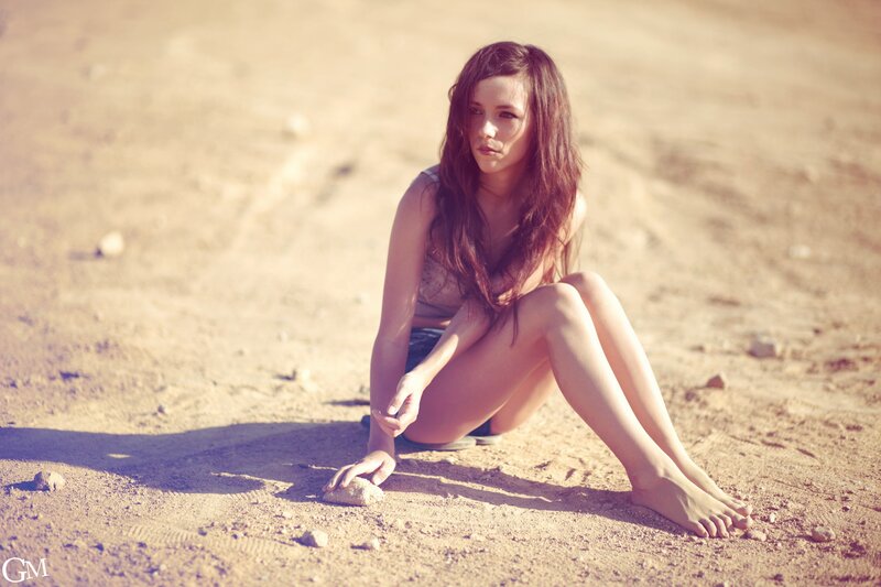 Woman Sitting on Sand — Brown, Contemplative