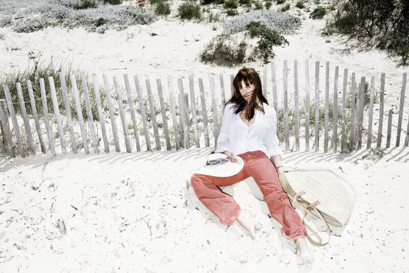 Woman Sitting on Sand — White