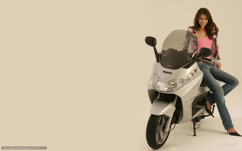 woman sitting on scooter