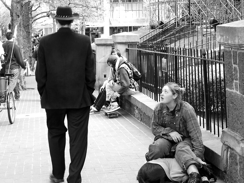 Woman Sitting on Sidewalk — Black