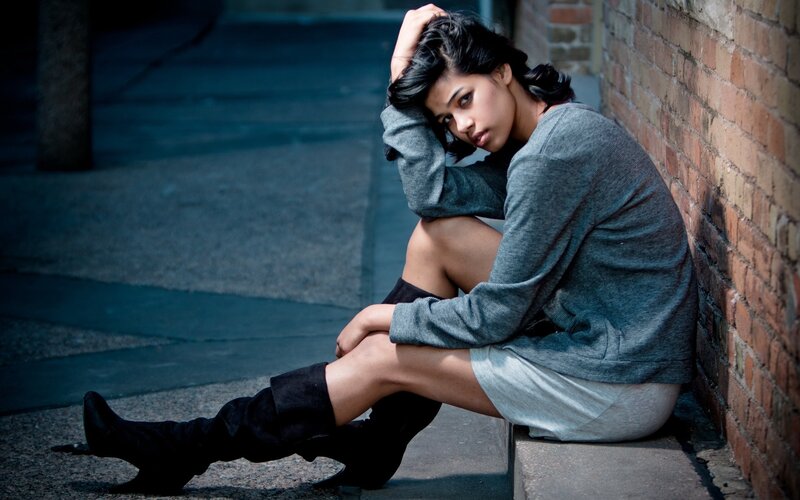 Woman Sitting on Sidewalk — Gray