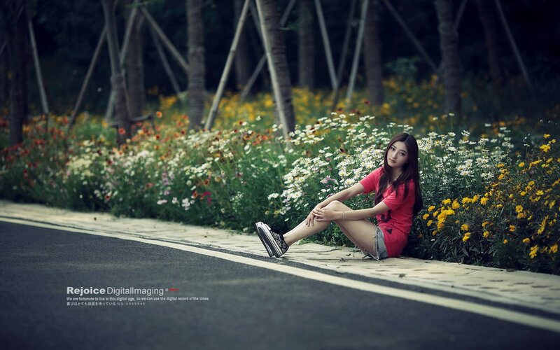 Woman Sitting on Sidewalk — Red