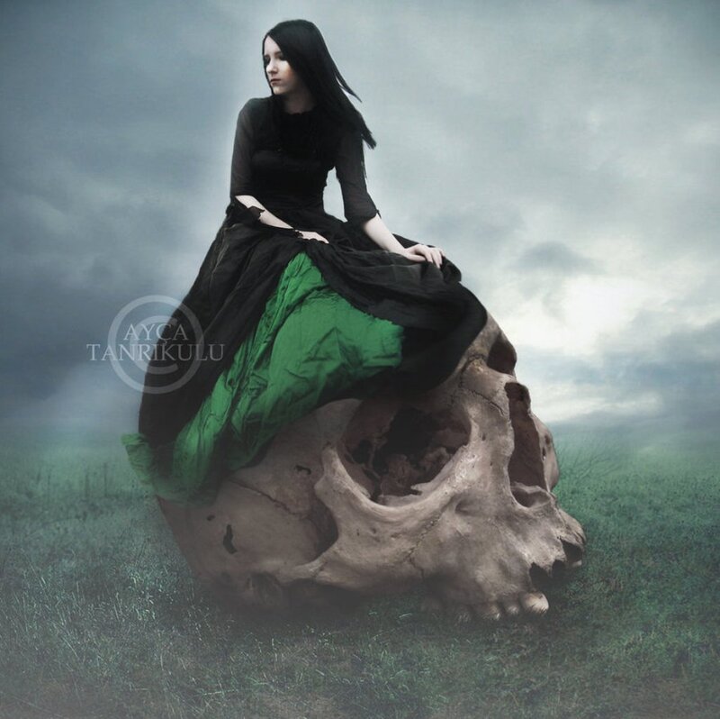 Woman Sitting on Skull — Black