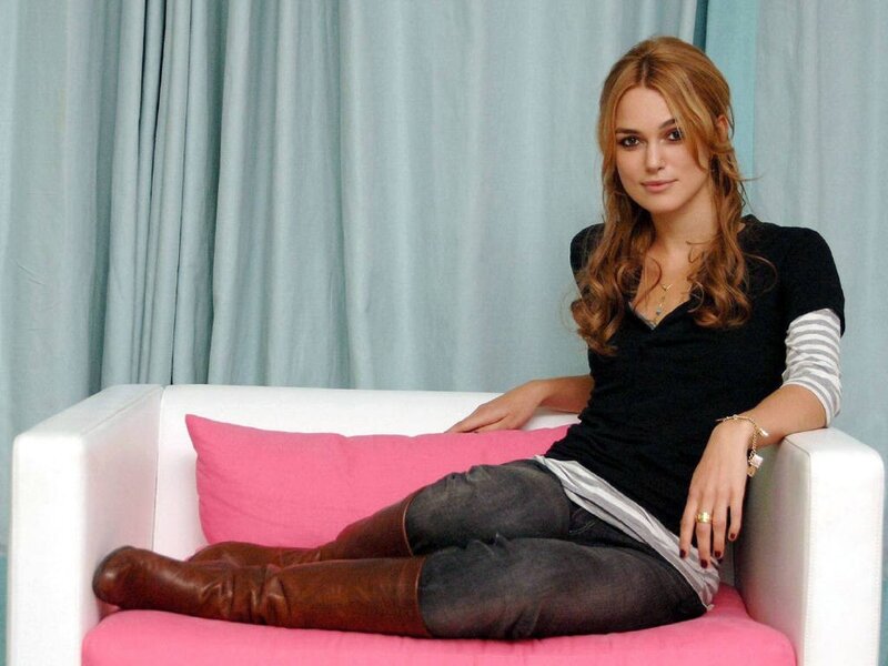 Woman Sitting on Sofa — White, Relaxed, Photograph, Pillow