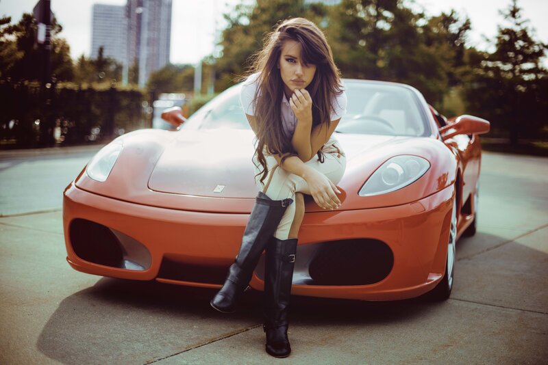 Woman Sitting on Sports Car — Orange