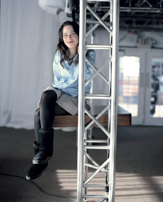 woman sitting on stage structure