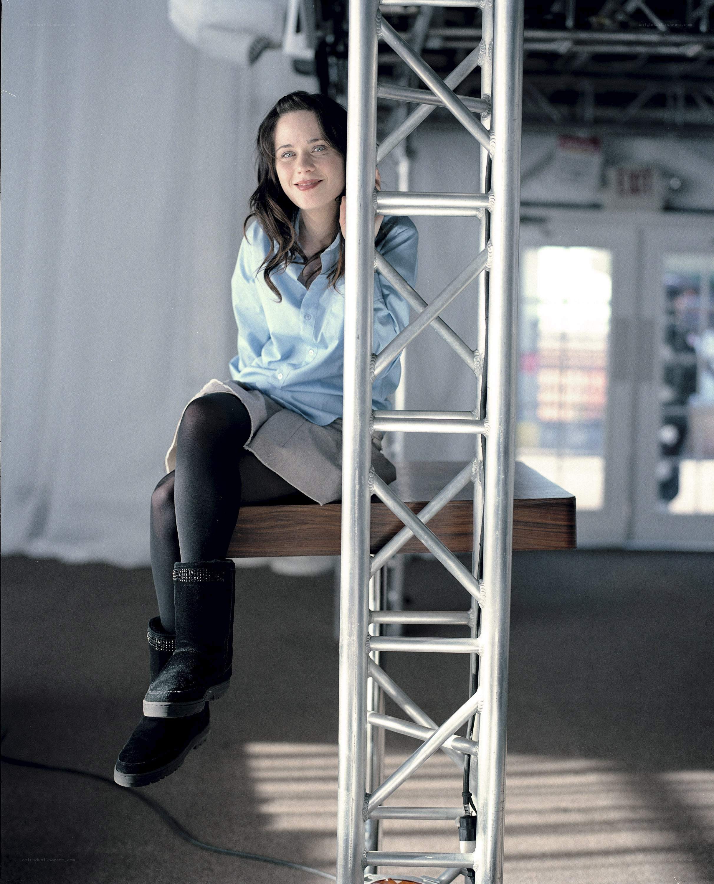 woman sitting on stage structure