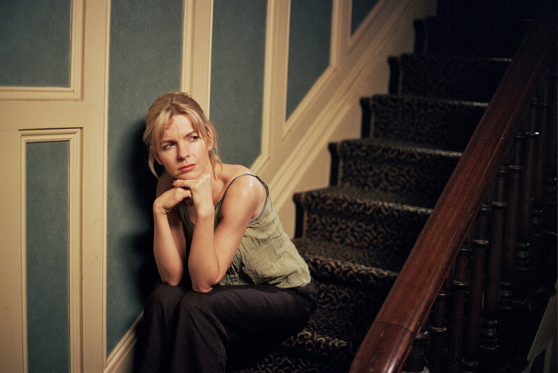 Woman Sitting on Stairs — Green, Somber
