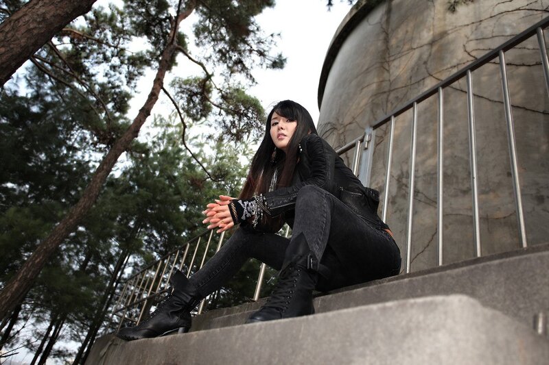 woman sitting on stairs outdoors