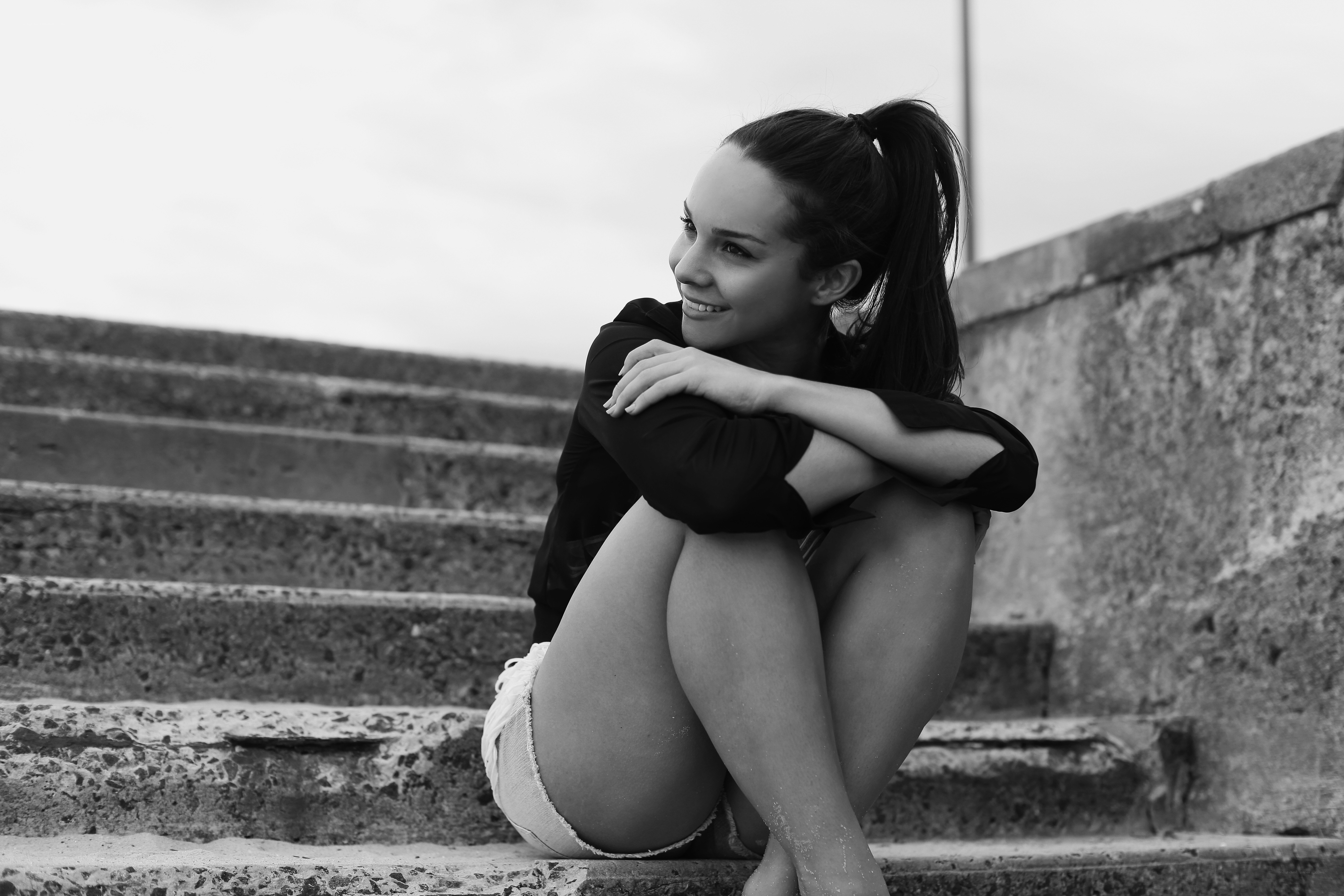 woman sitting on steps