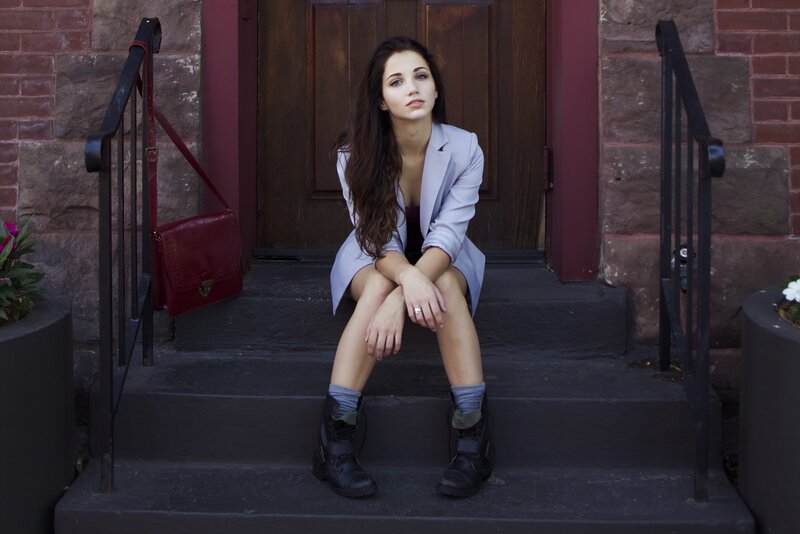 woman sitting on steps