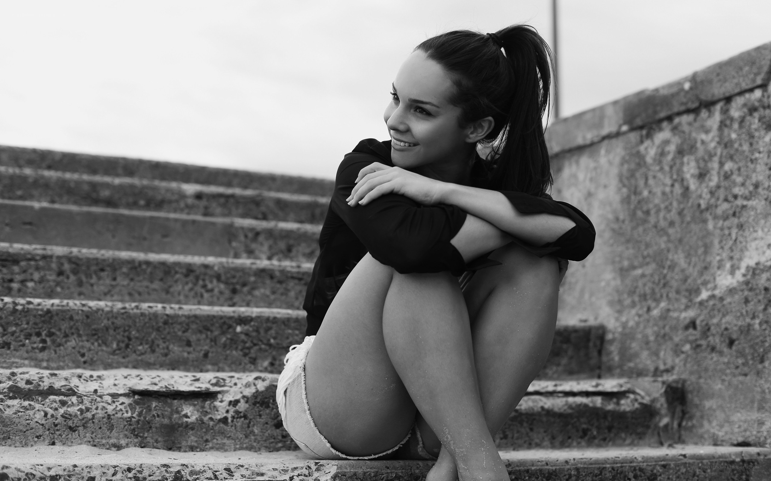 woman sitting on steps