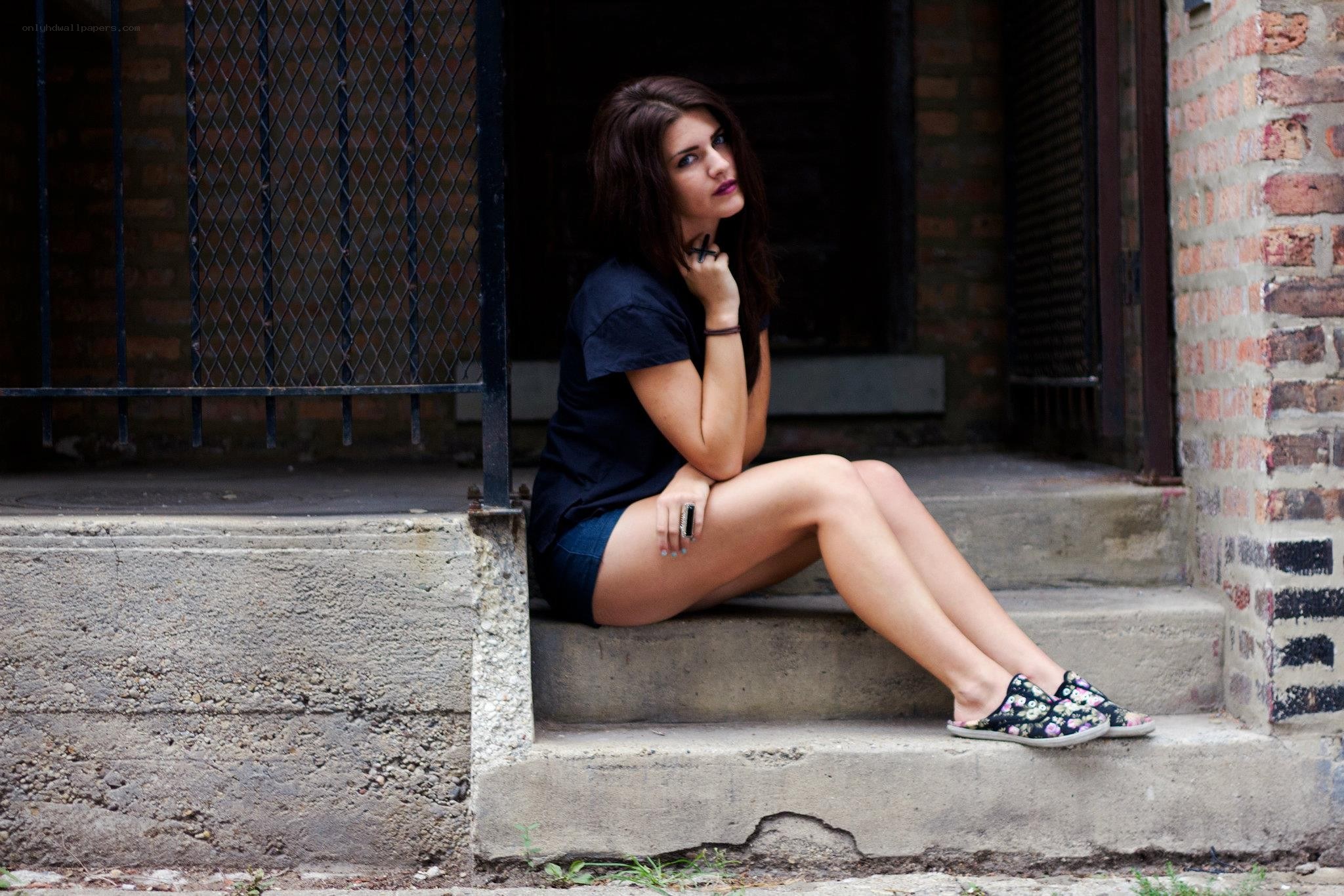 woman sitting on steps