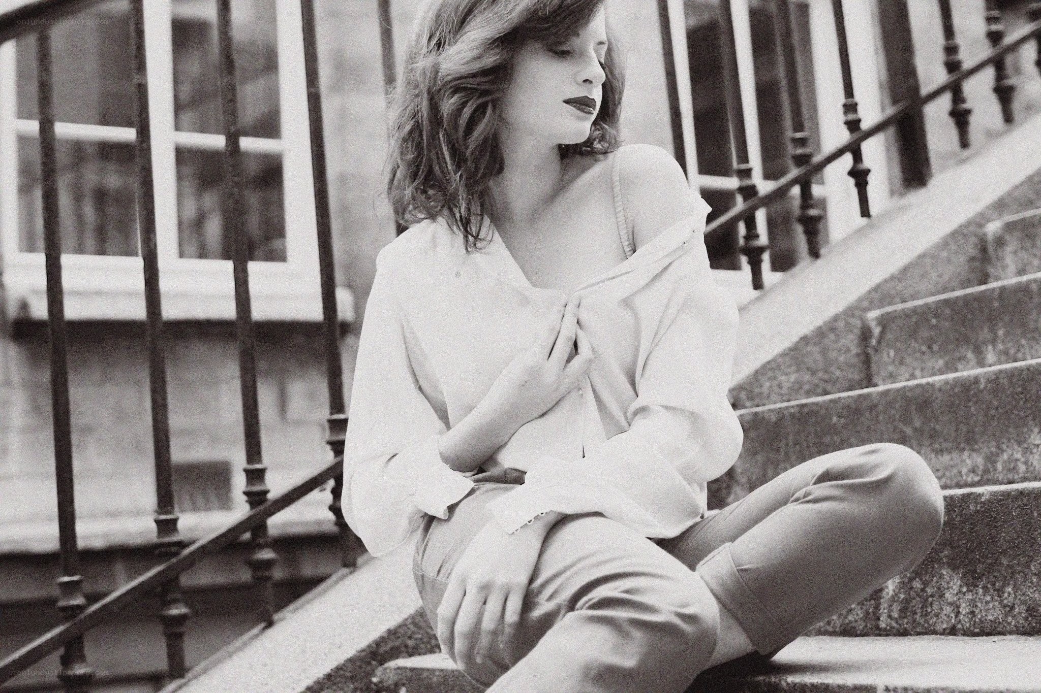 woman sitting on steps