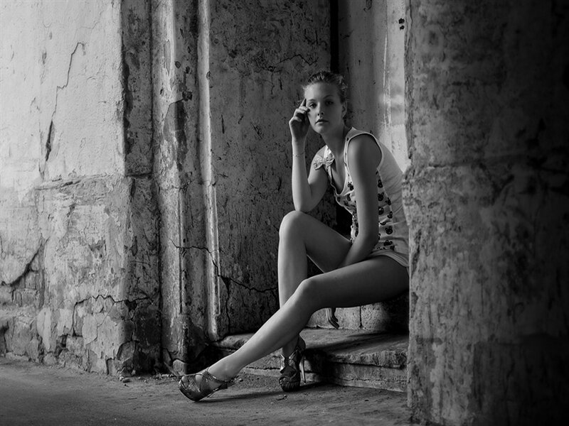 Woman Sitting on Steps — Black, Dramatic, Photograph, Concrete Wall