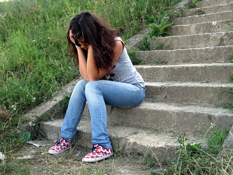 Woman Sitting on Steps — Blue