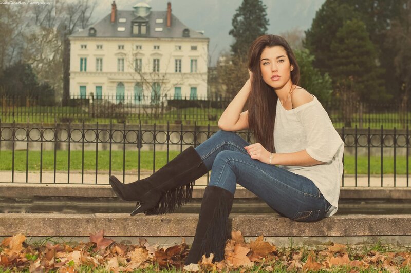 woman sitting on steps in autumn