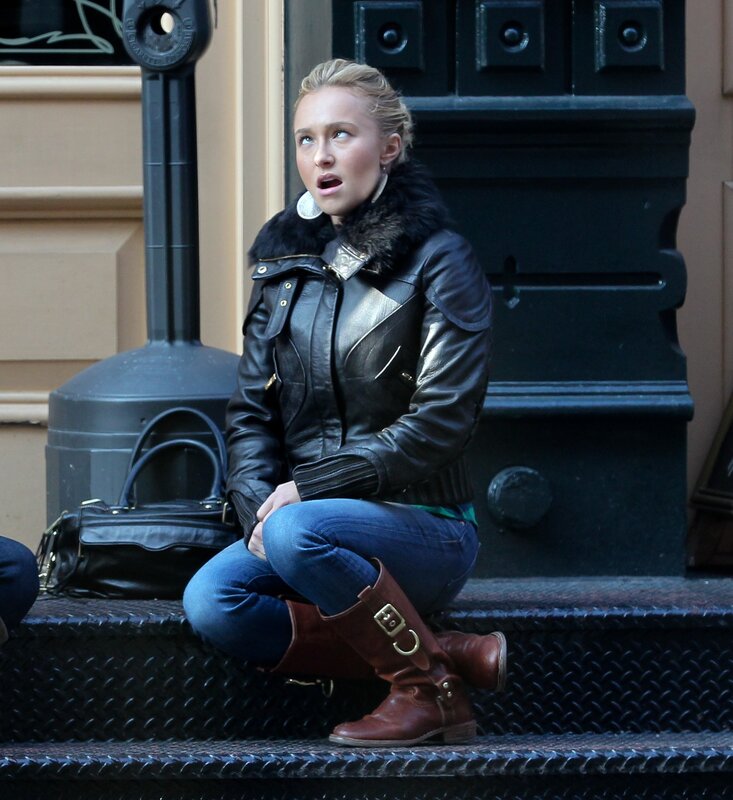 woman sitting on steps in leather jacket