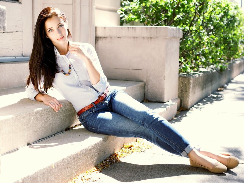 woman sitting on steps outdoors
