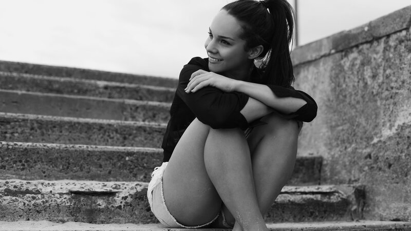 Woman Sitting on Steps — Photograph
