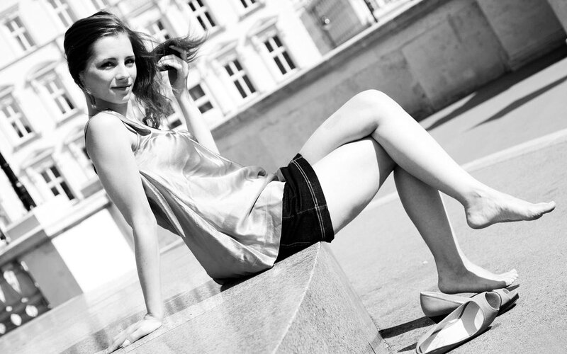 Woman Sitting on Stone — Black