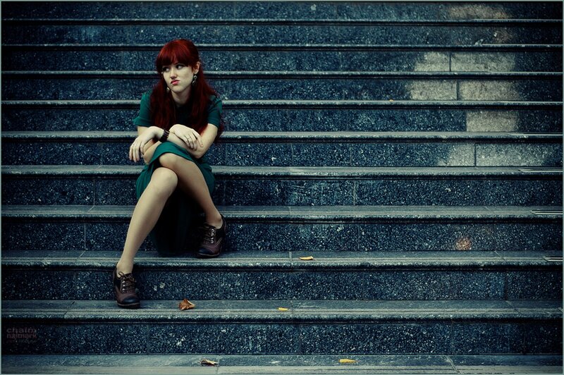 woman sitting on stone steps