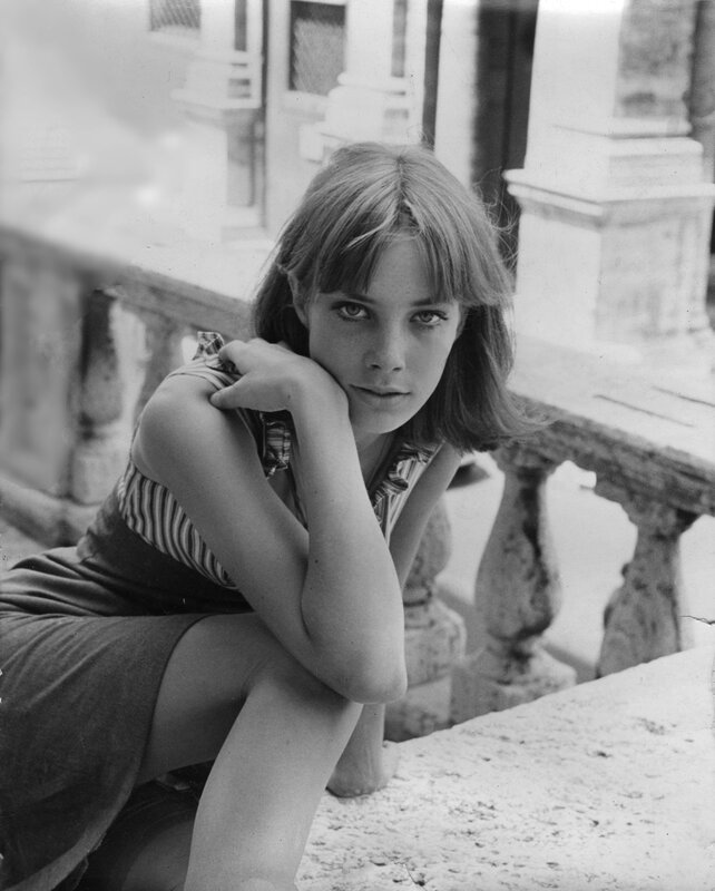 woman sitting on stone steps