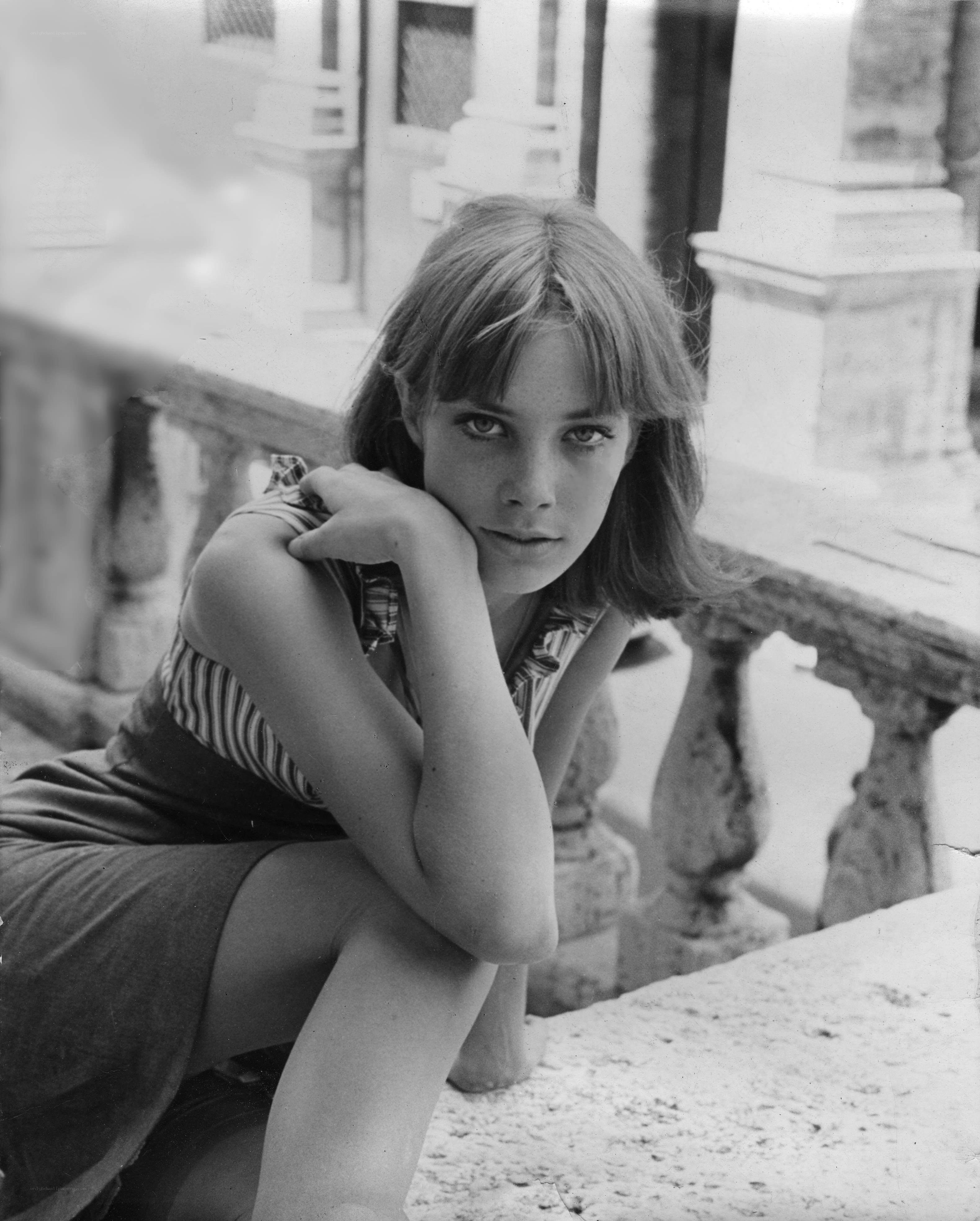 woman sitting on stone steps