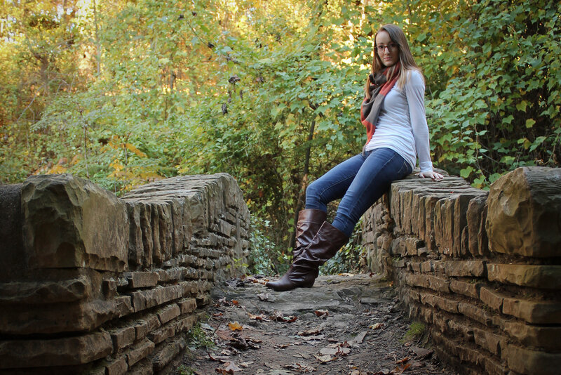 Woman Sitting on Stone Wall — Green