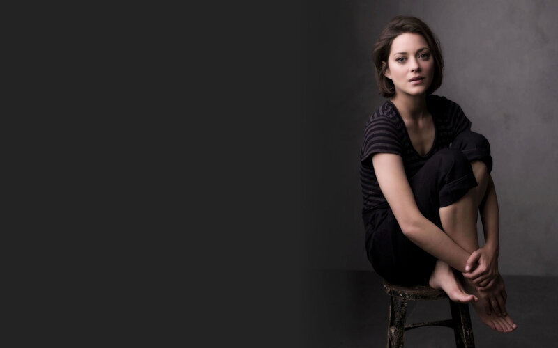 Woman Sitting on Stool — Black, Serious