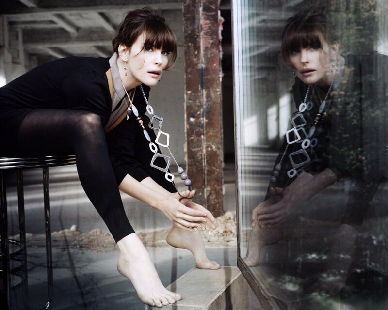 woman sitting on stool in industrial setting