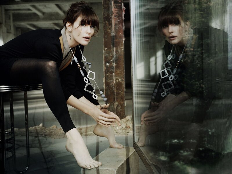 woman sitting on stool in industrial setting