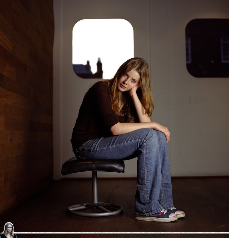 woman sitting on stool in studio