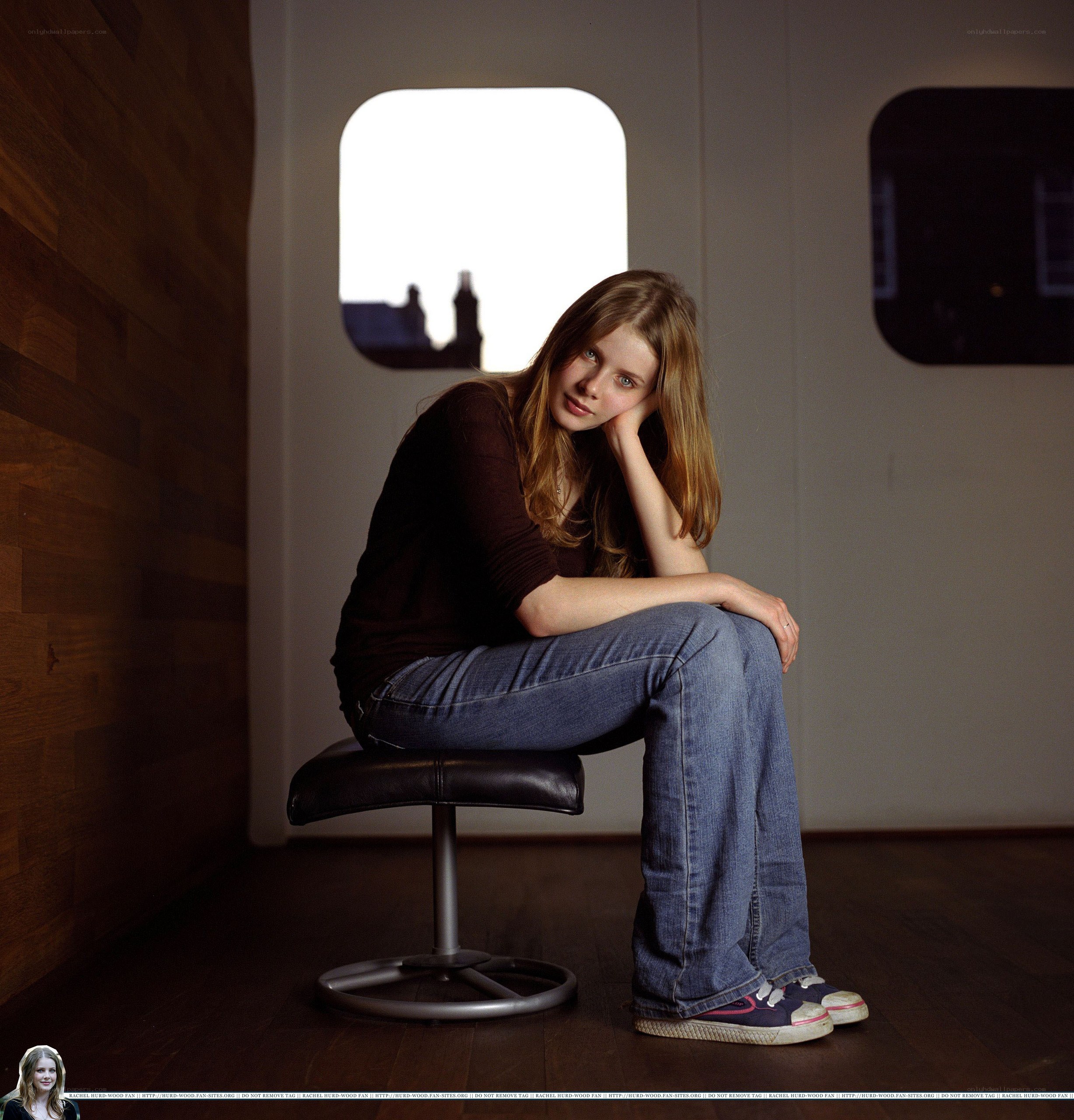 woman sitting on stool in studio