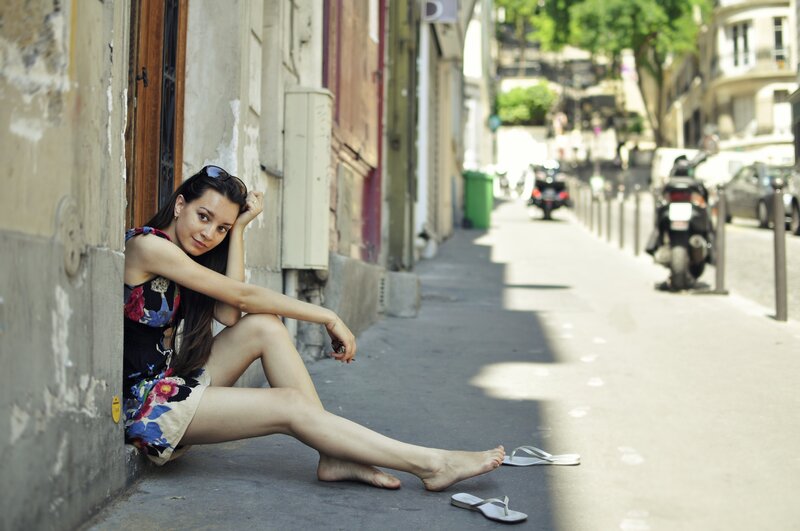 woman sitting on street