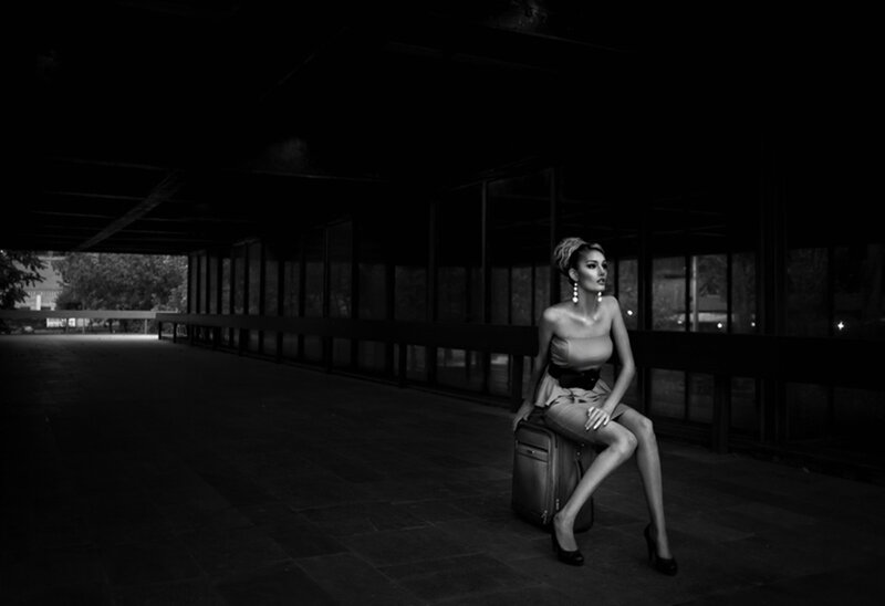 Woman Sitting on Suitcase — Black, Dramatic, Night