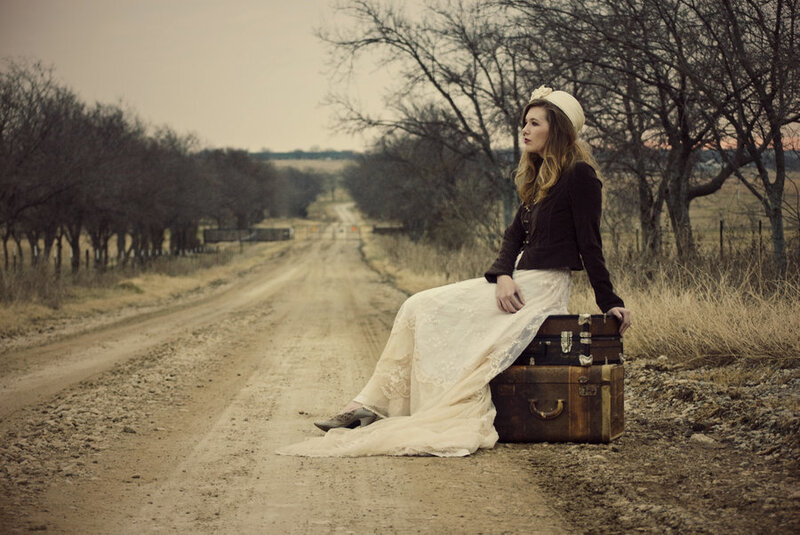 Woman Sitting on Suitcase — Brown, Melancholic, Sunset