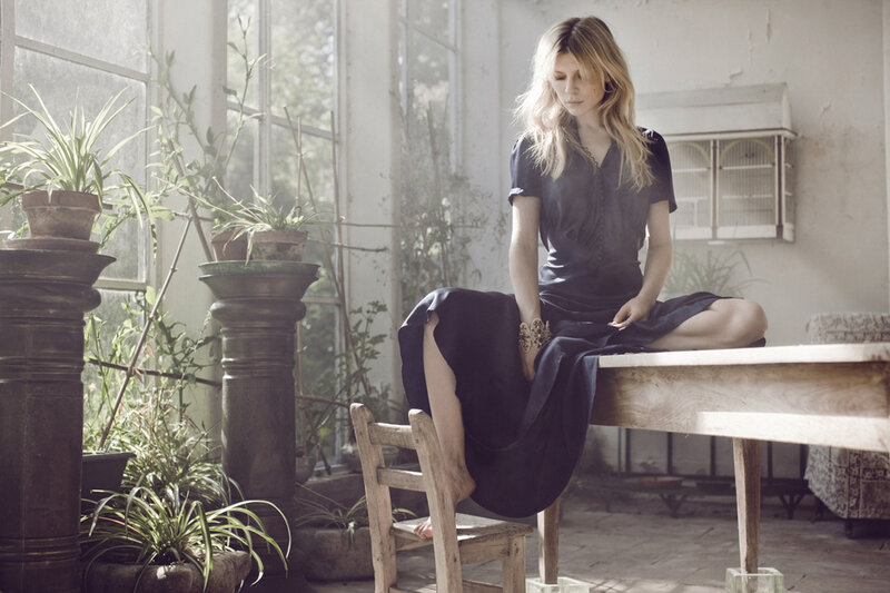 Woman Sitting on Table — Blue