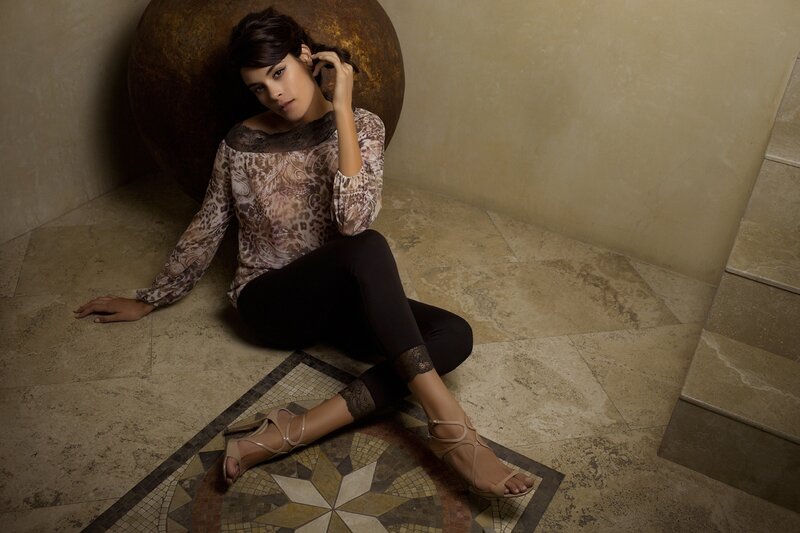 woman sitting on tiled floor