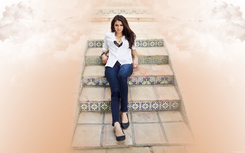 woman sitting on tiled stairs