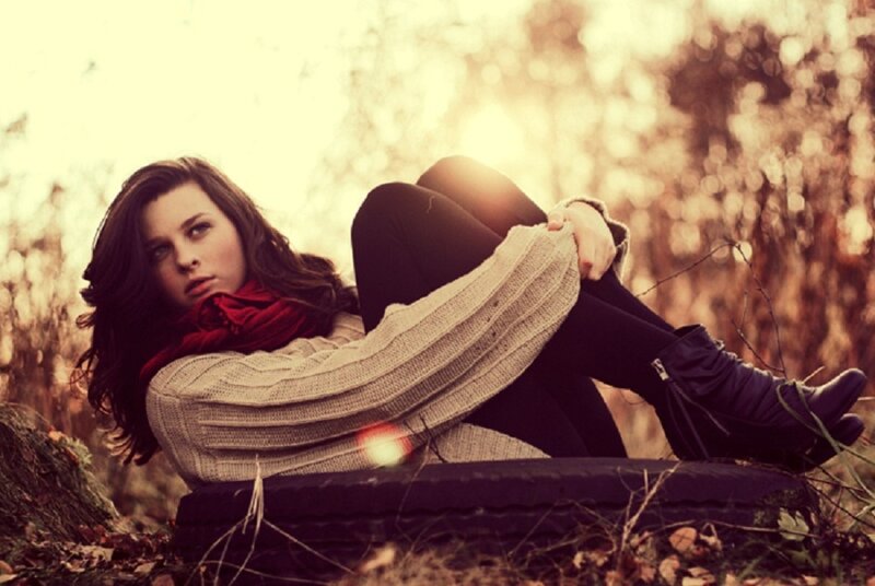 Woman Sitting on Tire