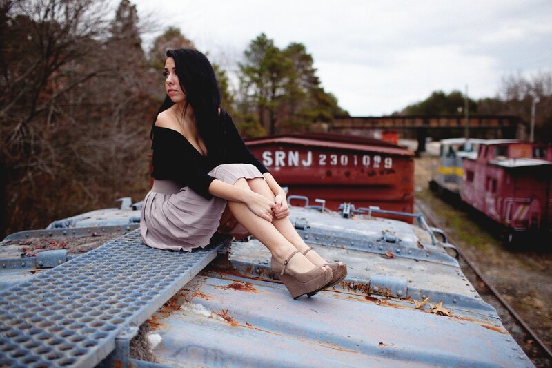 woman sitting on train car