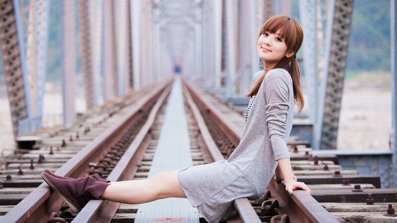 Woman Sitting on Train Tracks — Gray, Calm, Afternoon