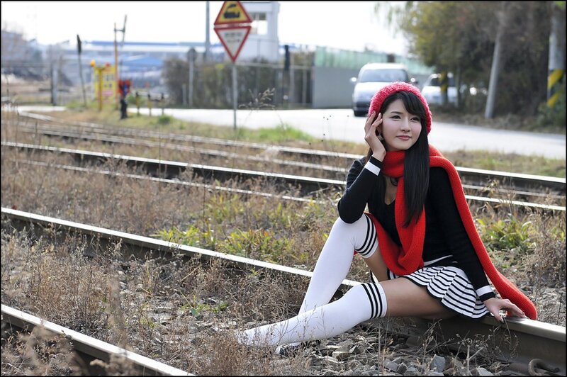 Woman Sitting on Train Tracks — Red, Calm, Autumn